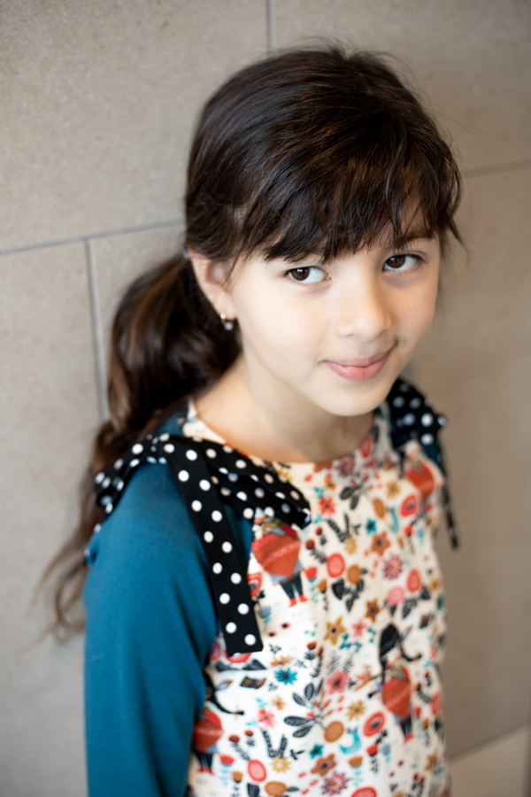 Aurora Raglan knit top with shoulder ties in rayon. Banded neckline.