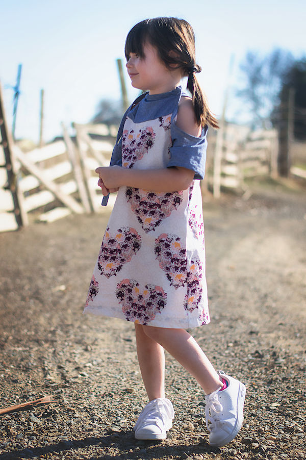 The cold shoulder Lynx dress with colour blocked yoke and mid length sleeves. High neckline with tie on one side.