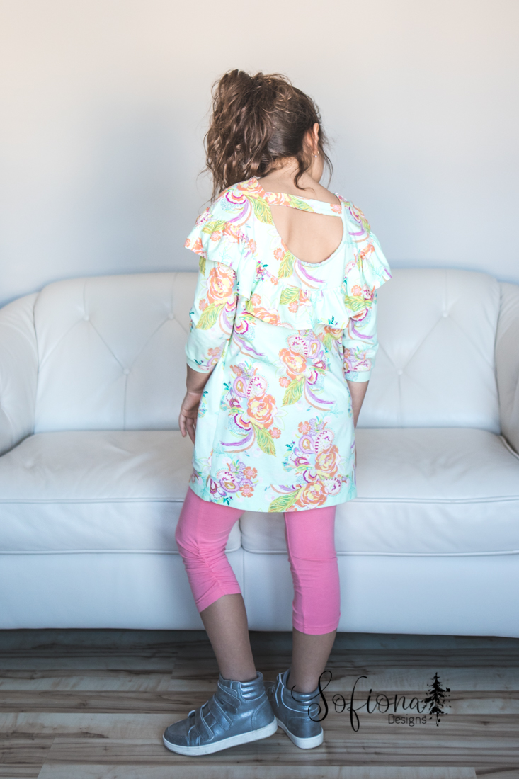 Rhubarb tunic length with scoop back and band, dropped shoulder and longer ruffled yoke. Knit fabric from Art Gallery Fabrics.