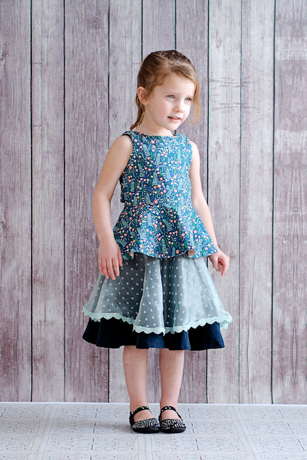 Juniper bow back top with tuxedo style bow. Circle peplum. Reversible shirt for everyday or special occasions. Pairs well with Pinecone skirt.