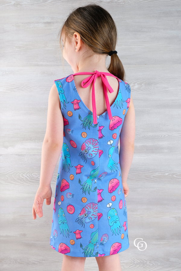 Moss knee length knit dress or swim cover with optional oversized hood and a V neckline in the back.