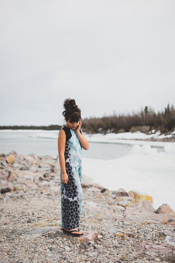Moss maxi length knit dress with angled bodice detail. Optional oversized hood with a V neckline in the back.