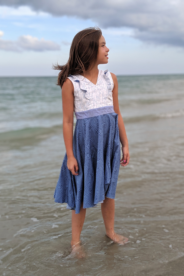 Fireweed Dress with princess seam ruffles and high low circle skirt.