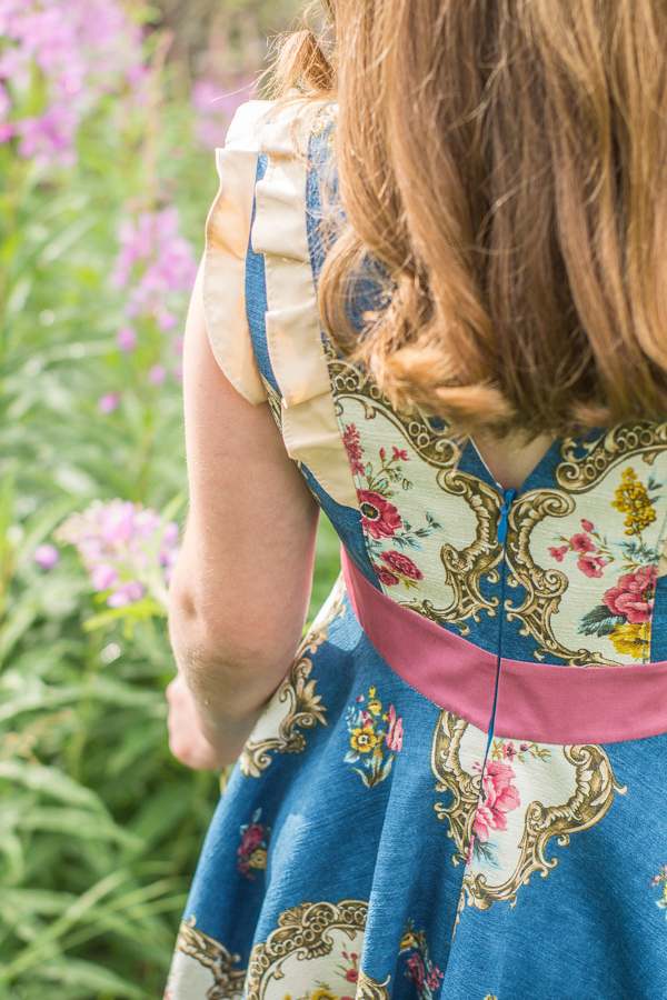 Gorgeous Fireweed dress with invisible zipper in the V neck at the back. Arm and princess seam flounces.