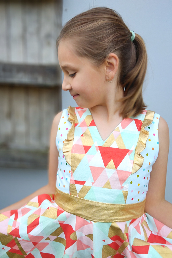 Pretty metallic accents on the Fireweed dress with princess seam flounces, V neckline and circle skirt.