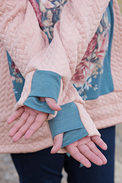 Bonfire Hoodie with 2 piece sleeves, hidden pocket, gusseted hood, unique thumbholes and a slight high low band on the hip.