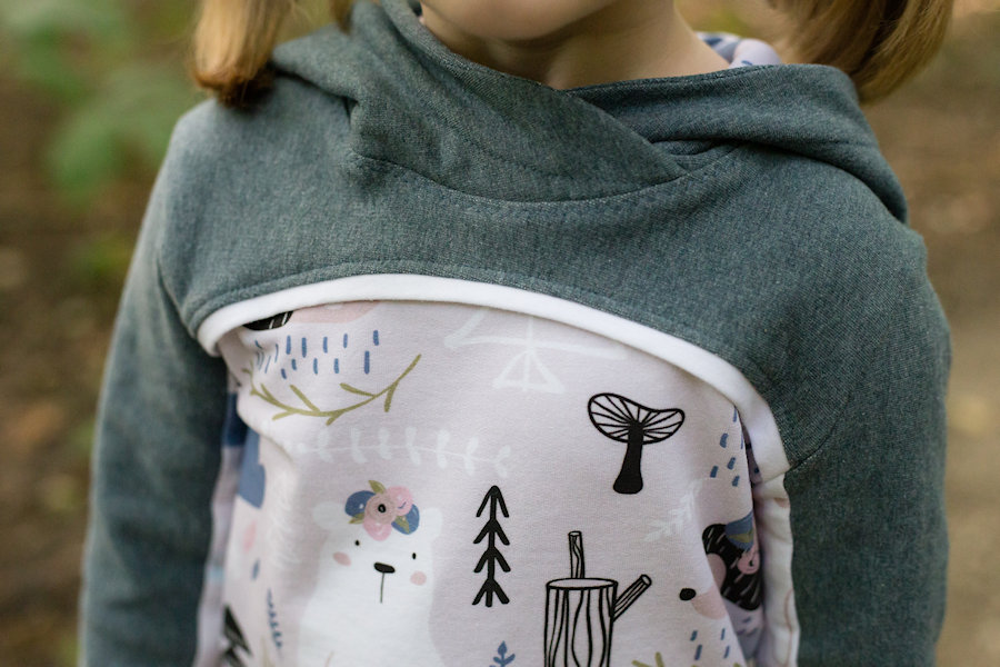 Bonfire Hoodie with 2 piece sleeves, hidden pocket, gusseted hood, unique thumbholes and a slight high low band on the hip.