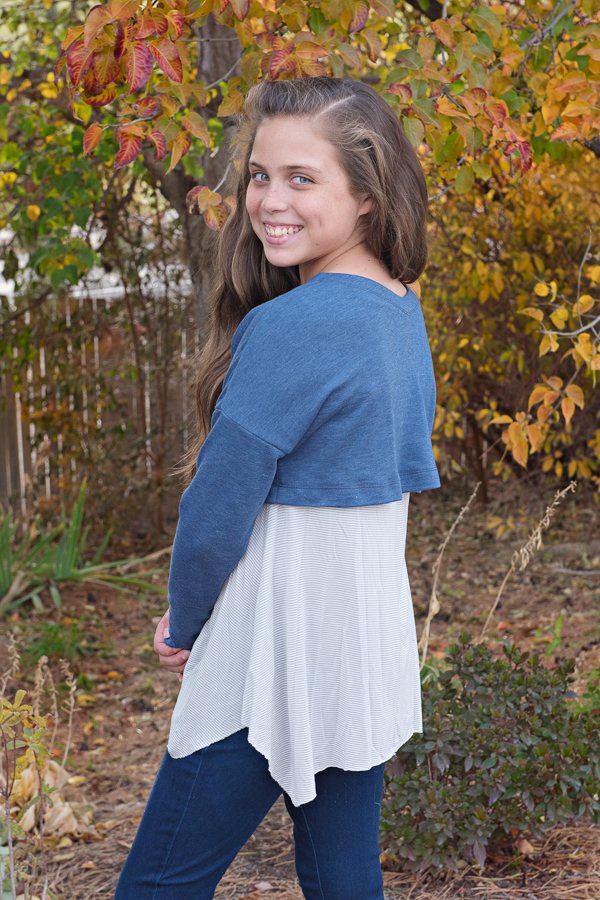 Tundra sweater in crop length and long sleeves. The faced neckline has a slight V in the back.