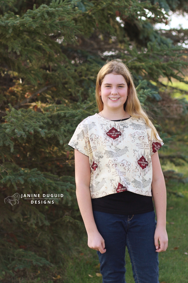 Tundra top in waist length and short sleeves. Shown over the Dandelion Tank top for teen look.