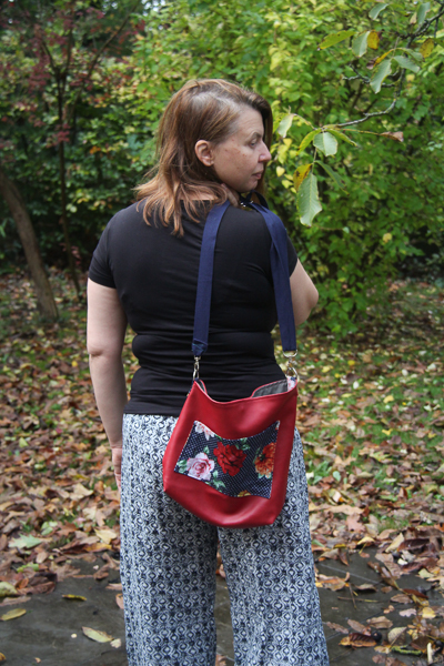 The Balsam Bag fundraising bag for A21. Envelope corners, angled top, cross body strap and front pocket.