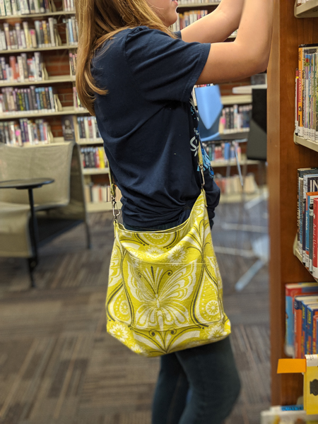 The Balsam Bag fundraising bag for A21. Envelope corners, angled top, cross body strap and front pocket. Great for teens.