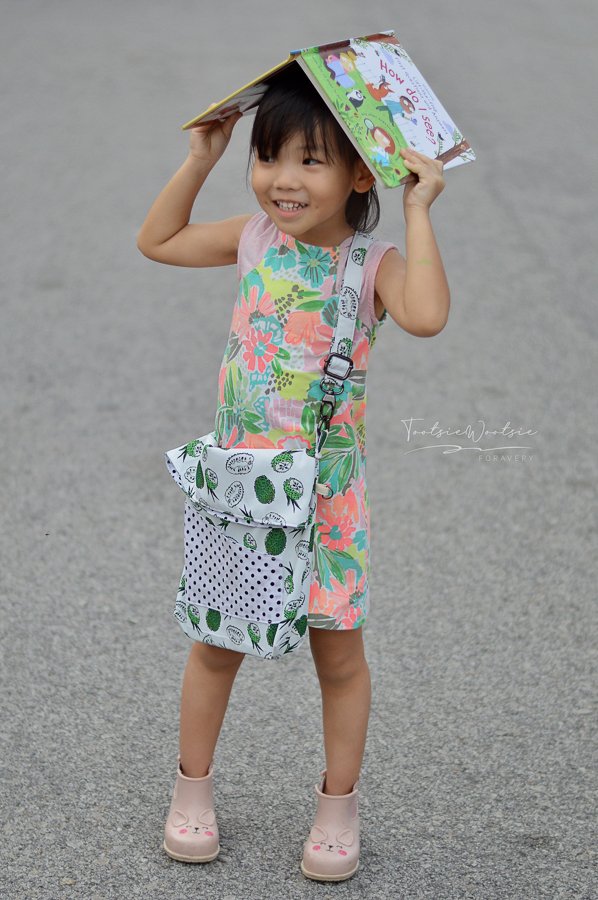 The Balsam Bag fundraising bag for A21. Envelope corners, fold over top, cross body strap and front pocket. For girls and women.