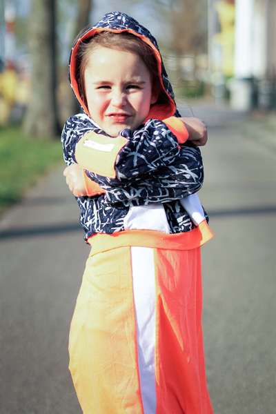 Clover Hoodie by Sofiona Designs. Cropped length, long sleeves with welt zipper pocket and hood. Shown over Cattail dress.