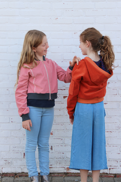 Two Rose Hip jackets. One with a hood and one with the bomber style neckband.