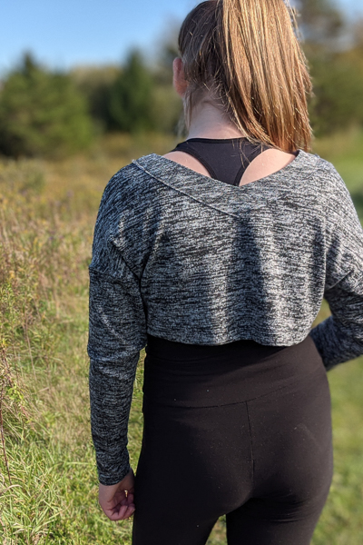 The Miss Tundra top in crop length and long sleeves with visible neckline facing.