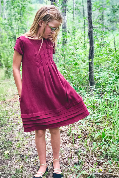 The Haze by Sofiona Designs for girls' sizes 2-16 in the dress length with bubble tuck bodice and pleated hem.