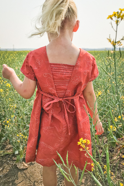 The Haze by Sofiona Designs for girls' sizes 2-16 in the dress length with simple hem and pleated V back.