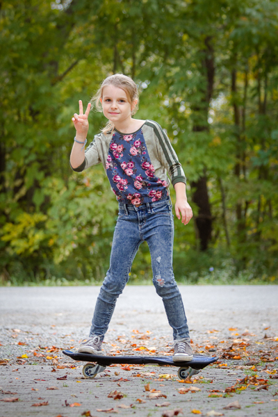 A raglan sweater with batwing sleeves and elastic waistband in girls' sizes 2-16. 