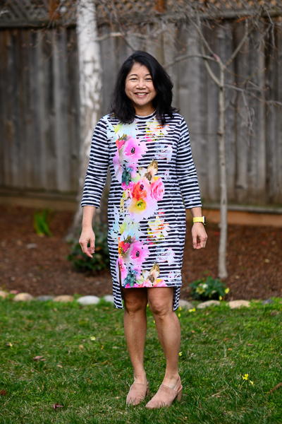 Knee length knit dress with high-low split hem and 3/4 sleeves.