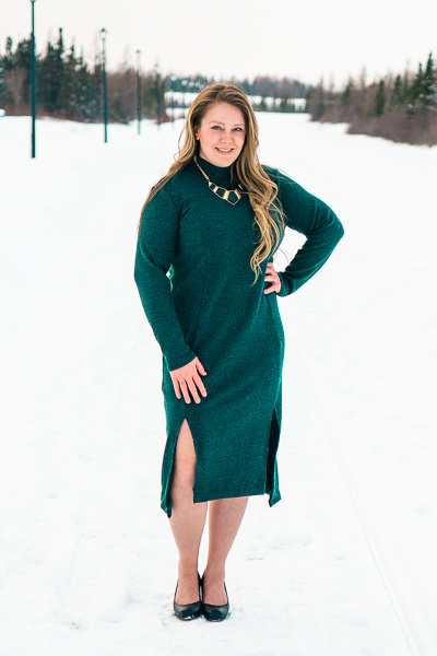 Rib knit calf length dress with split hem, high neck and princess seams.