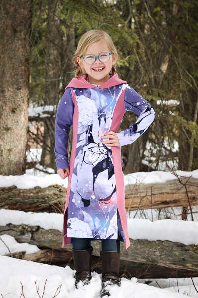 Calf length knit dress with high-low split hem, princess seams and cozy hood.