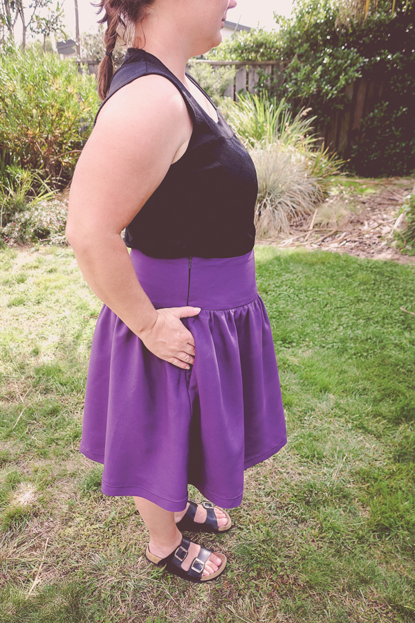 Side view of the invisible zipper and inseam pocket in the Miss Fern short skirt.