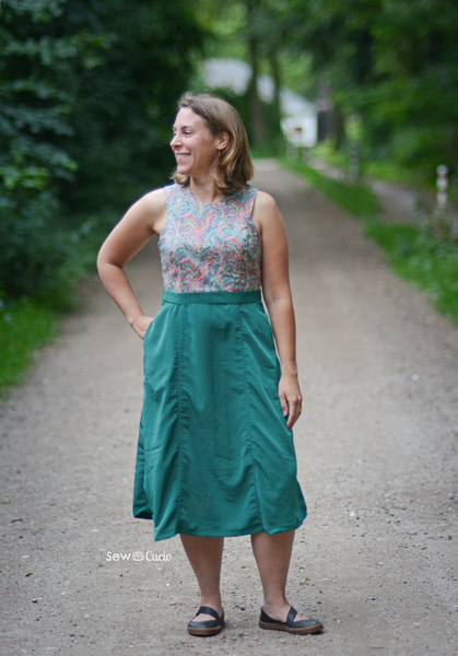 The Miss Forest dress with sleeveless bodice and midi length panel skirt.