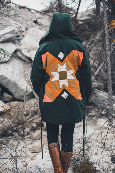 Quilted back detail on forest green wool coat.