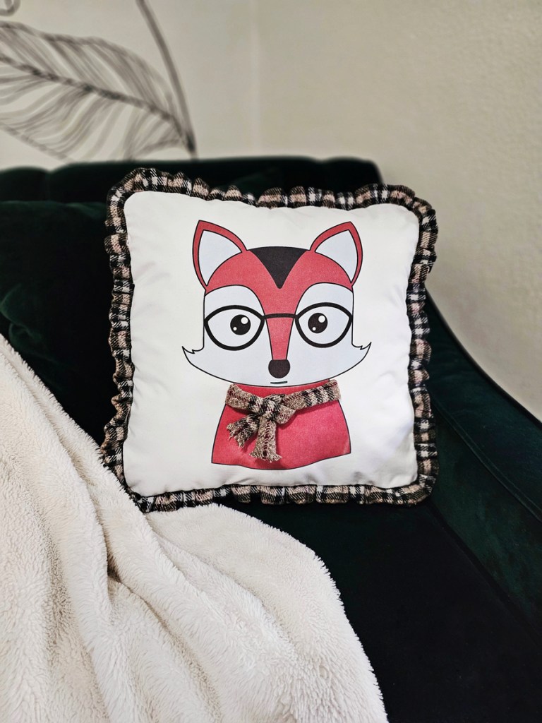 The Honeysuckle box pillow with Northern Creature HTV and appliqué.